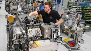 man working on large marine engine