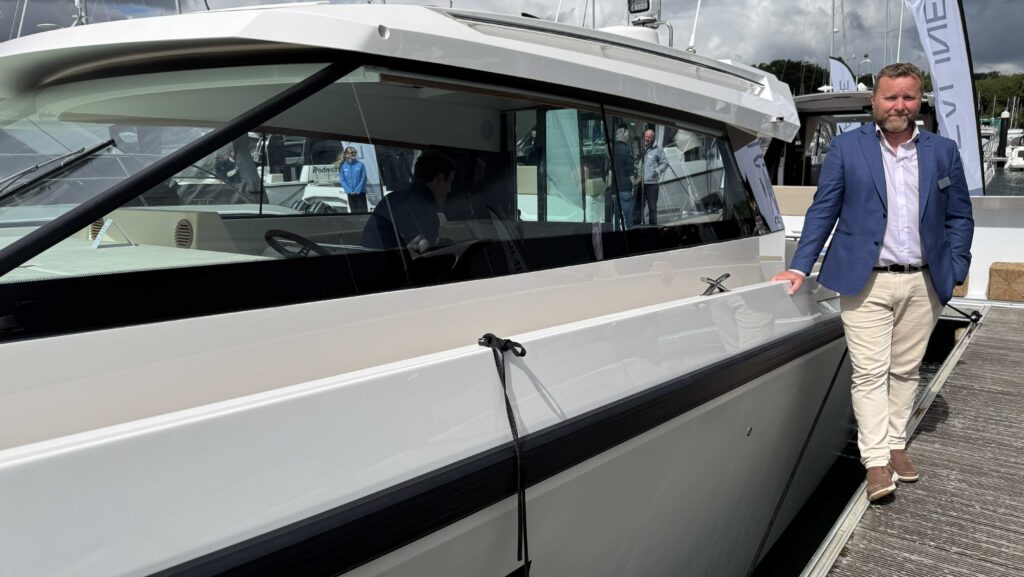 Simon Rosier SE Yachts Director next to Delta Coupé boat