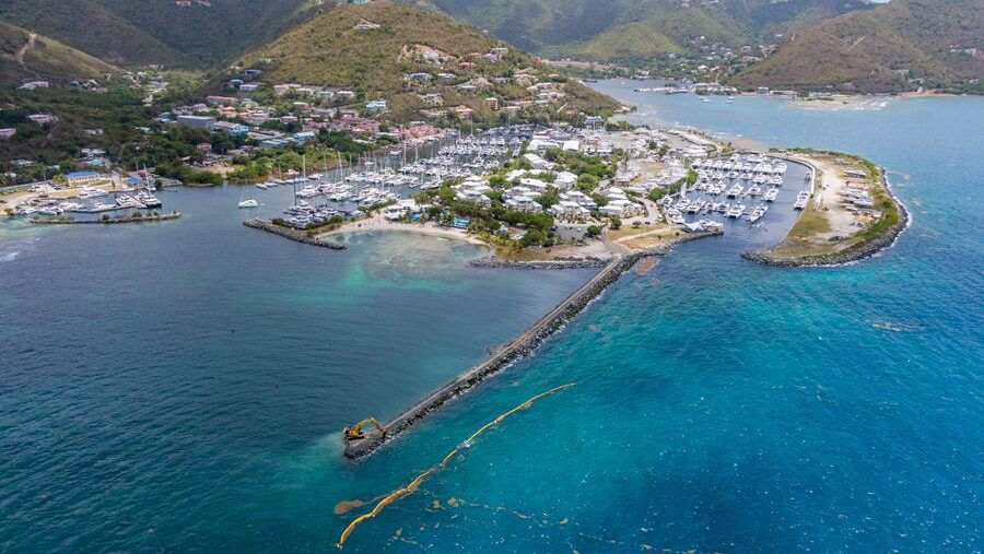 Aerial view of Caribbean marina and mountain backdrop